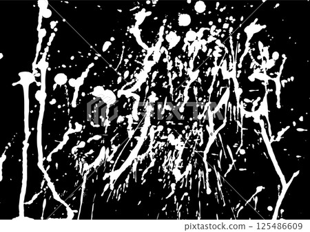 White ink dripping liquid and splashes on black background White ink dripping liquid and splashes on black background 125486609