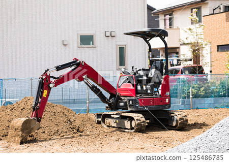 Construction site: Mini backhoe 125486785
