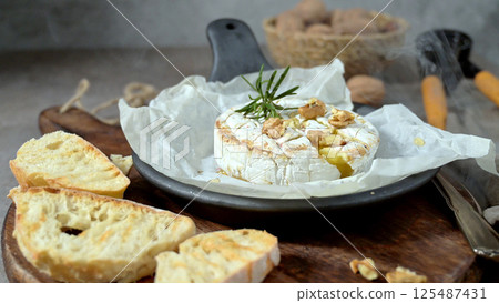 Fresh sliced Camembert cheese 125487431
