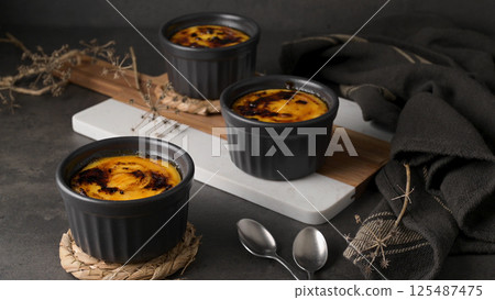 Bowls with Creme brulee Bowls with Creme brulee 125487475