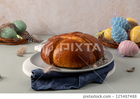 A golden folar cake is the centerpiece A golden folar cake is the centerpiece 125487488