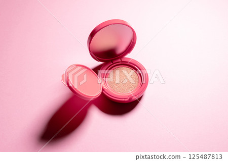 Cushion foundation pink background Cushion foundation pink background 125487813