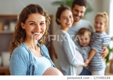 surrogate mother smiling alongside a family. family, surrogacy, parenting, and the bond of love and support in the journey of parenthood surrogate mother smiling alongside a family. family, surrogacy, parenting, and the bond of love and support in the journey of parenthood 125490289