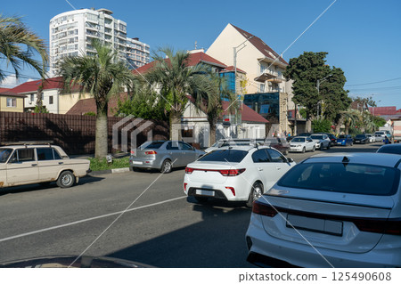 Road with cars in a resort town. 125490608