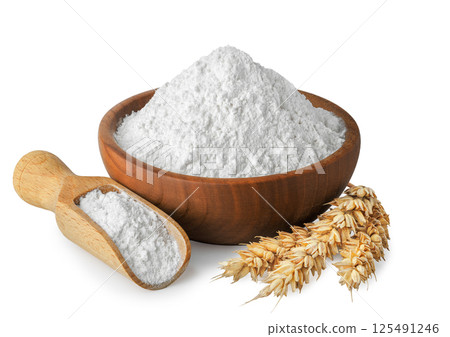 wheat flour in wooden bowl and scoop with ears near isolated on white background wheat flour in wooden bowl and scoop with ears near isolated on white background 125491246