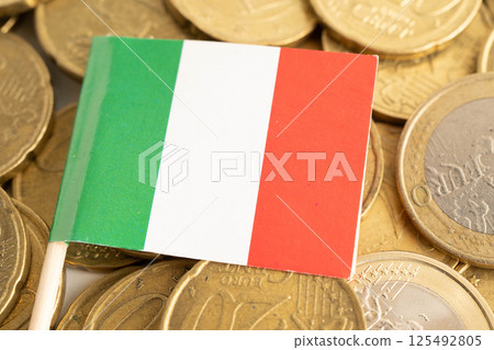 Italy flag on coin and banknote money, finance trading investment business currency concept. Italy flag on coin and banknote money, finance trading investment business currency concept. 125492805