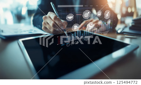 Business Professional Analyzing Data Trends with Modern Technology and Digital Marketing Strategy in Contemporary Workspace XDMCP Business Professional Analyzing Data Trends with Modern Technology and Digital Marketing Strategy in Contemporary Workspace XDMCP 125494772