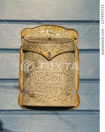 antique letter box at a wooden door antique letter box at a wooden door 125495515