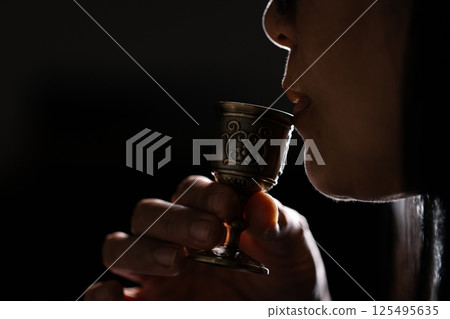 Sacred ceremony of Communion, Christians express their faith by partaking in holy bread, deepening their spiritual connection with God within the church. communion, religion, christian, faith, holy. Sacred ceremony of Communion, Christians express their faith by partaking in holy bread, deepening their spiritual connection with God within the church. communion, religion, christian, faith, holy. 125495635