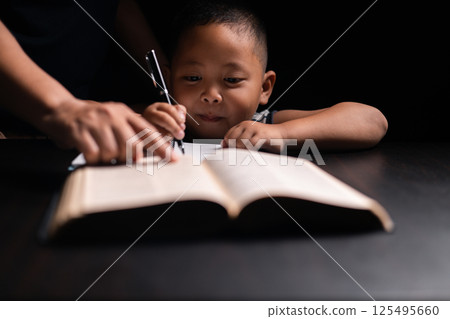 A mother teaches her child about Jesus Christ and the Christian faith, reading the Bible together and nurturing his belief in God. child, jesus christ, bible, christian, mother, person, faith, boy. A mother teaches her child about Jesus Christ and the Christian faith, reading the Bible together and nurturing his belief in God. child, jesus christ, bible, christian, mother, person, faith, boy. 125495660