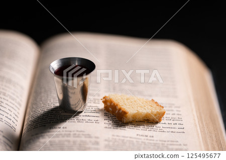 Communion, Christians celebrate their faith by partaking in bread and wine, symbolizing the body and blood of Jesus Christ, as taught in the Bible and cherished in their holy religion. communion, holy Communion, Christians celebrate their faith by partaking in bread and wine, symbolizing the body and blood of Jesus Christ, as taught in the Bible and cherished in their holy religion. communion, holy 125495677