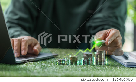 Green finance is driving economic growth with investments in sustainable energy reflected in rising graphs across business and financial sectors. finance, economy, green, business, investment, graph. 125495799