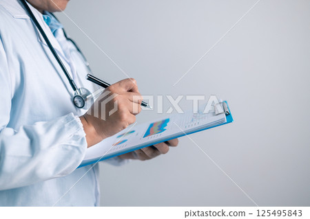 Doctor, equipped with a stethoscope, provided medical care to the patient at clinic, ensuring their health and well-being as a dedicated physician in the health care system. doctor, medical, health. Doctor, equipped with a stethoscope, provided medical care to the patient at clinic, ensuring their health and well-being as a dedicated physician in the health care system. doctor, medical, health. 125495843