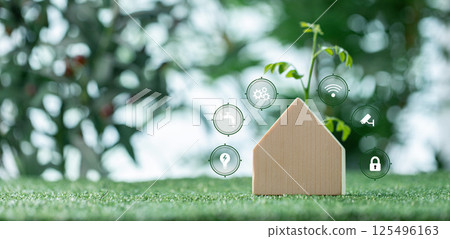 Green architecture of home integrates environmentally friendly facilities with house design that features grass-covered roof and eco-friendly selection of building materials. green, environment. 125496163