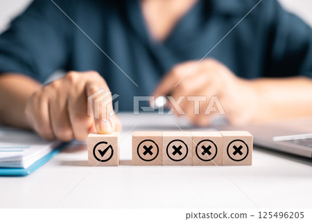 Wooden cube with an OK mark symbolizes approved choices in business, representing correctness and acceptance in decision-making. approved, wooden, cube, ok, correct, accept, business, agree, approval Wooden cube with an OK mark symbolizes approved choices in business, representing correctness and acceptance in decision-making. approved, wooden, cube, ok, correct, accept, business, agree, approval 125496205