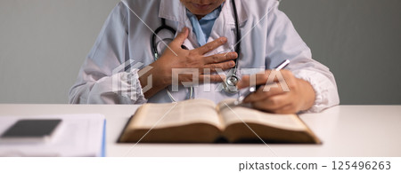 Doctor prays for the health of the person under their care, as medicine, nurses, and health care at the hospital work together to fight the disease. doctor, pray, health, person, medicine, care. Doctor prays for the health of the person under their care, as medicine, nurses, and health care at the hospital work together to fight the disease. doctor, pray, health, person, medicine, care. 125496263