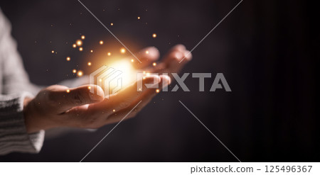 Woman clasped her hands in prayer, filled with faith and hope, believing in Jesus Christ, and seeking the holy presence of God through her prayers in the spirit of Christian religion. pray, woman. 125496367