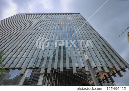 April 19 2025 Modern High-Rise Building Against a Cloudy Sky with Urban Architecture April 19 2025 Modern High-Rise Building Against a Cloudy Sky with Urban Architecture 125496415