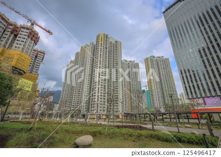 April 19 2025 Modern Skyscrapers and Construction in an Urban Park Setting 125496417