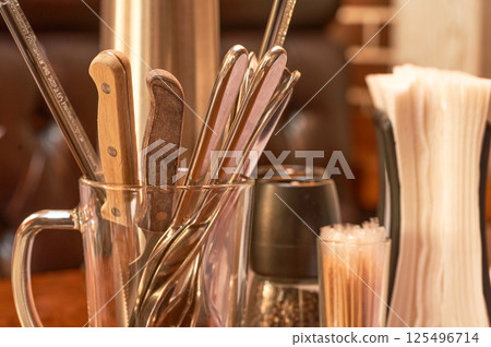 Set of kitchen utensils in a glass jar, closeup. Selective focus. Set of kitchen utensils in a glass jar, closeup. Selective focus. 125496714
