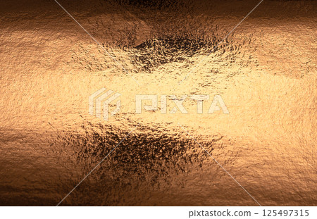 Copper foil background with a beautiful, textured surface. Gold and golden hues glistening with a 125497315