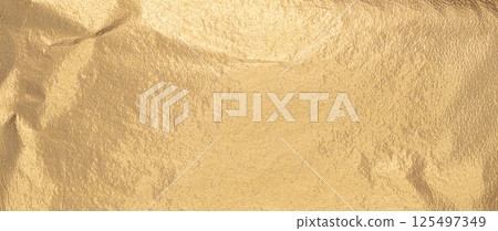 Gold foil background with soft matte texture and glistering finish. Long horizontal banner with 125497349