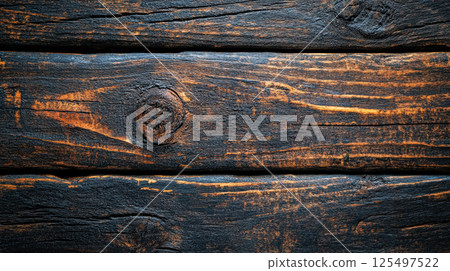 The wood grain is dark and the wood is burnt 125497522