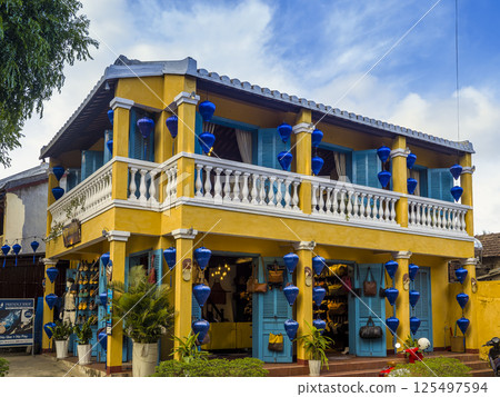 Buildings decorated with blue lanterns in the old town of Hoi An, Vietnam 125497594