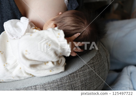 Breastfeeding mother and 2-month-old baby Breastfeeding mother and 2-month-old baby 125497722