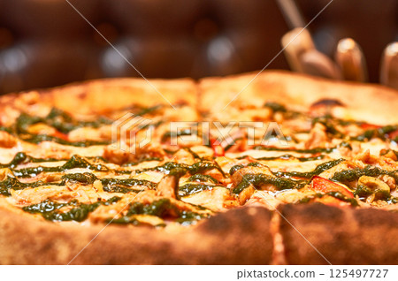 Fresh pizza close-up. Fast food. 125497727