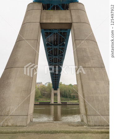 Foundation concrete pillars abutment and Steel truss construction with fabricated box of The Queen Elizabeth II Bridge. 125497912