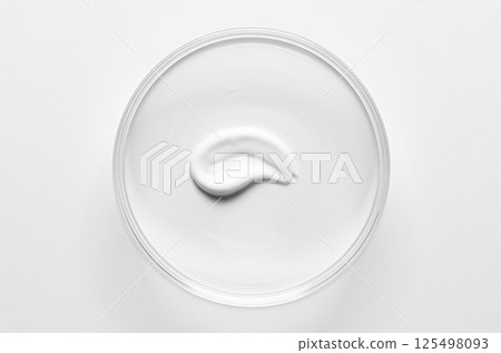 A sample of cosmetic moisturizing or anti-aging cream in a petri dish. A sample of cosmetic moisturizing or anti-aging cream in a petri dish. 125498093
