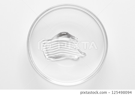 A sample of cosmetic moisturizing or anti-aging cream in a petri dish. 125498094