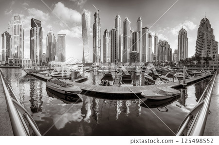 Skyscrapers and bridge over water, black and white style, city background, Dubai Marina bay UAE 125498552