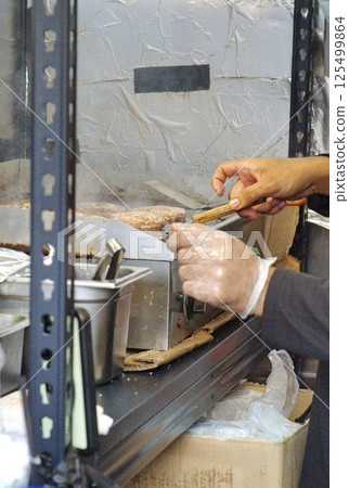 Night bazaar stall selling burgers 125499864