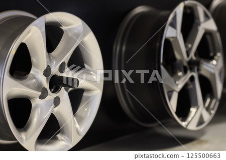 Stylish Automotive Alloy Wheels Display in a modern and chic presentation for car enthusiasts Stylish Automotive Alloy Wheels Display in a modern and chic presentation for car enthusiasts 125500663