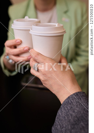 Coffees on a Table A Special Moment of Enjoyment Shared with Friends Over Delicious Brews 125500810