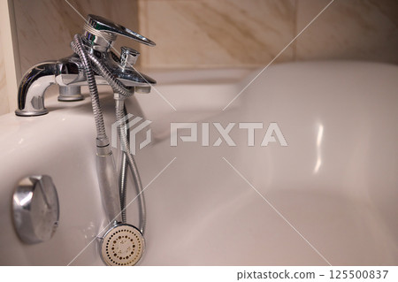 Explore trends in Modern Bathroom Faucet and Tub Design, focusing on elegance and style 125500837