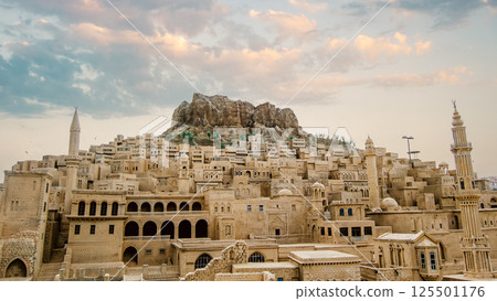 Landscape view of old Mardin city in Turkey with cloudy sky. Landscape view of old Mardin city in Turkey with cloudy sky. 125501176
