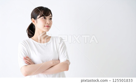 AI image: A young woman thinking with her arms folded 125501833