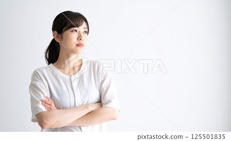 AI image: A young woman thinking with her arms folded 125501835