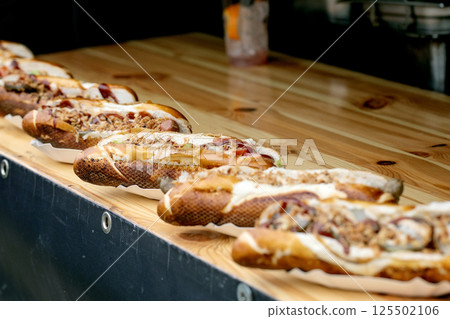 Gourmet Hot Dogs On Wooden Counter Gourmet Hot Dogs On Wooden Counter 125502106