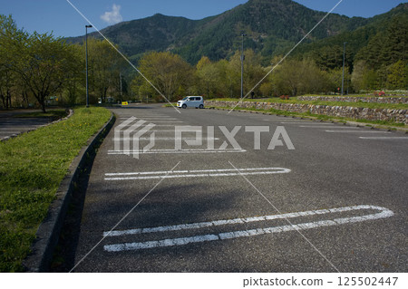 Early morning park parking lot 125502447