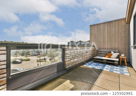 A contemporary rooftop terrace featuring stylish furniture and a scenic view, perfect for relaxation and social gatherings with a blend of comfort and aesthetics. A contemporary rooftop terrace featuring stylish furniture and a scenic view, perfect for relaxation and social gatherings with a blend of comfort and aesthetics. 125502991