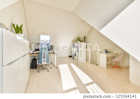 A sleek and modern home office featuring a minimalist design, large windows allowing natural light, greenery, and an organized workstation for productivity. A sleek and modern home office featuring a minimalist design, large windows allowing natural light, greenery, and an organized workstation for productivity. 125504141