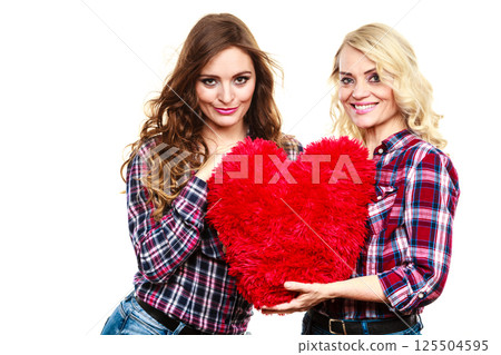 adult daughter and mother with heart love sign 125504595