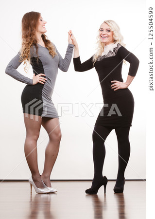 Elegant mother and daughter posing 125504599