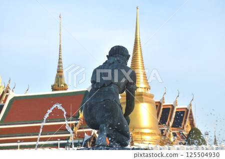 earth goddess on fountain in front of temple of emerald Buddha or wat Phra Kaew travel location and landmark in Thailand in sunset 125504930