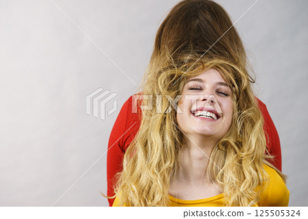 Two girls creating hairdo. Hair ombre color 125505324