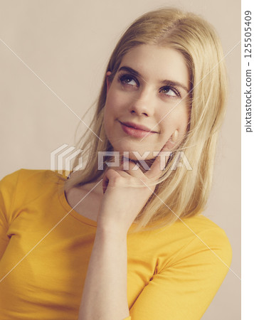 Young woman thinking seeks solution. 125505409